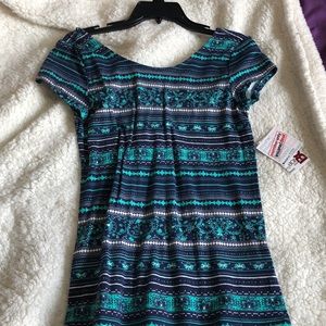 navy blue top with green and white detailing